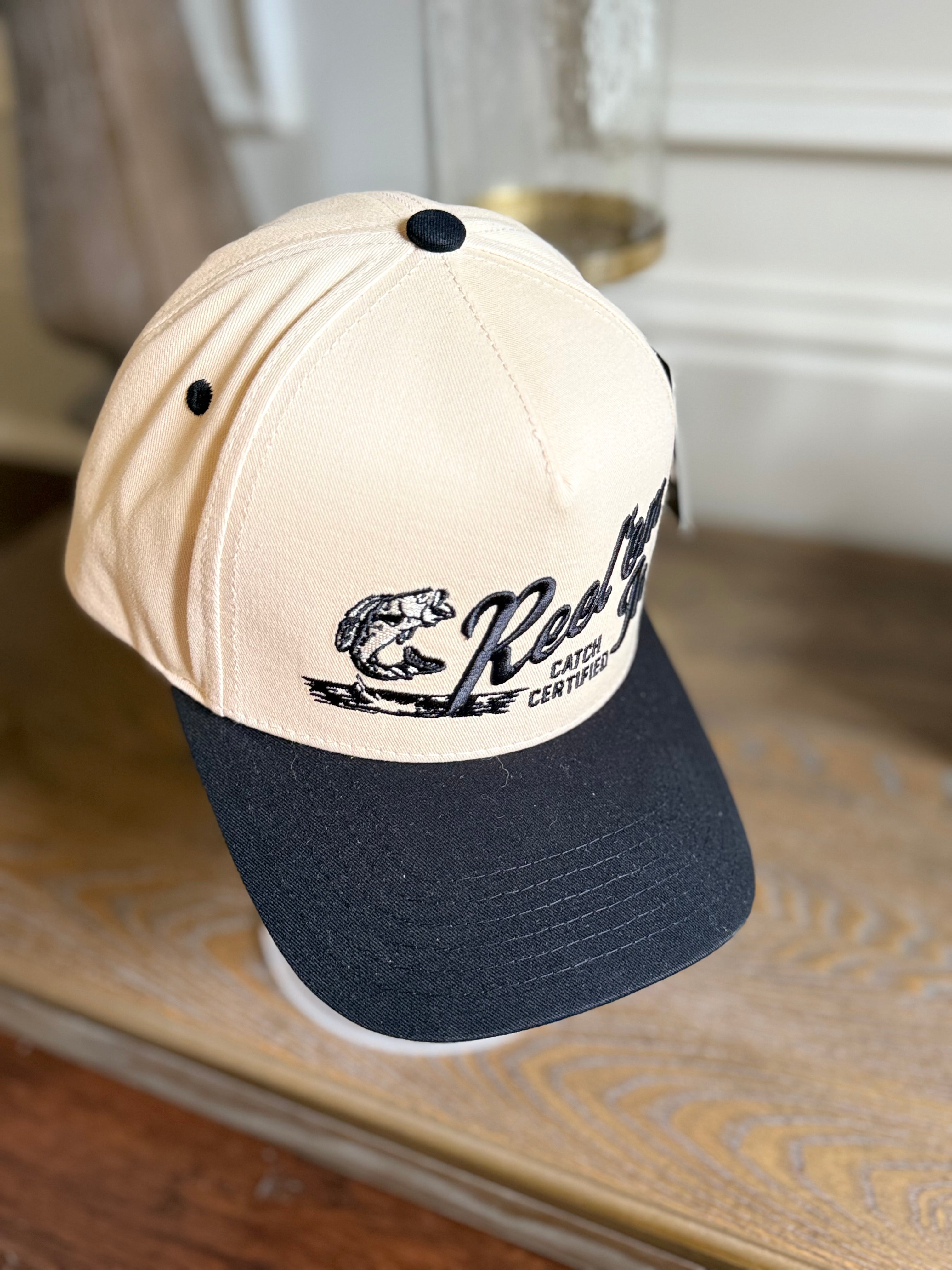 REEL EM IN BLACK/TAN